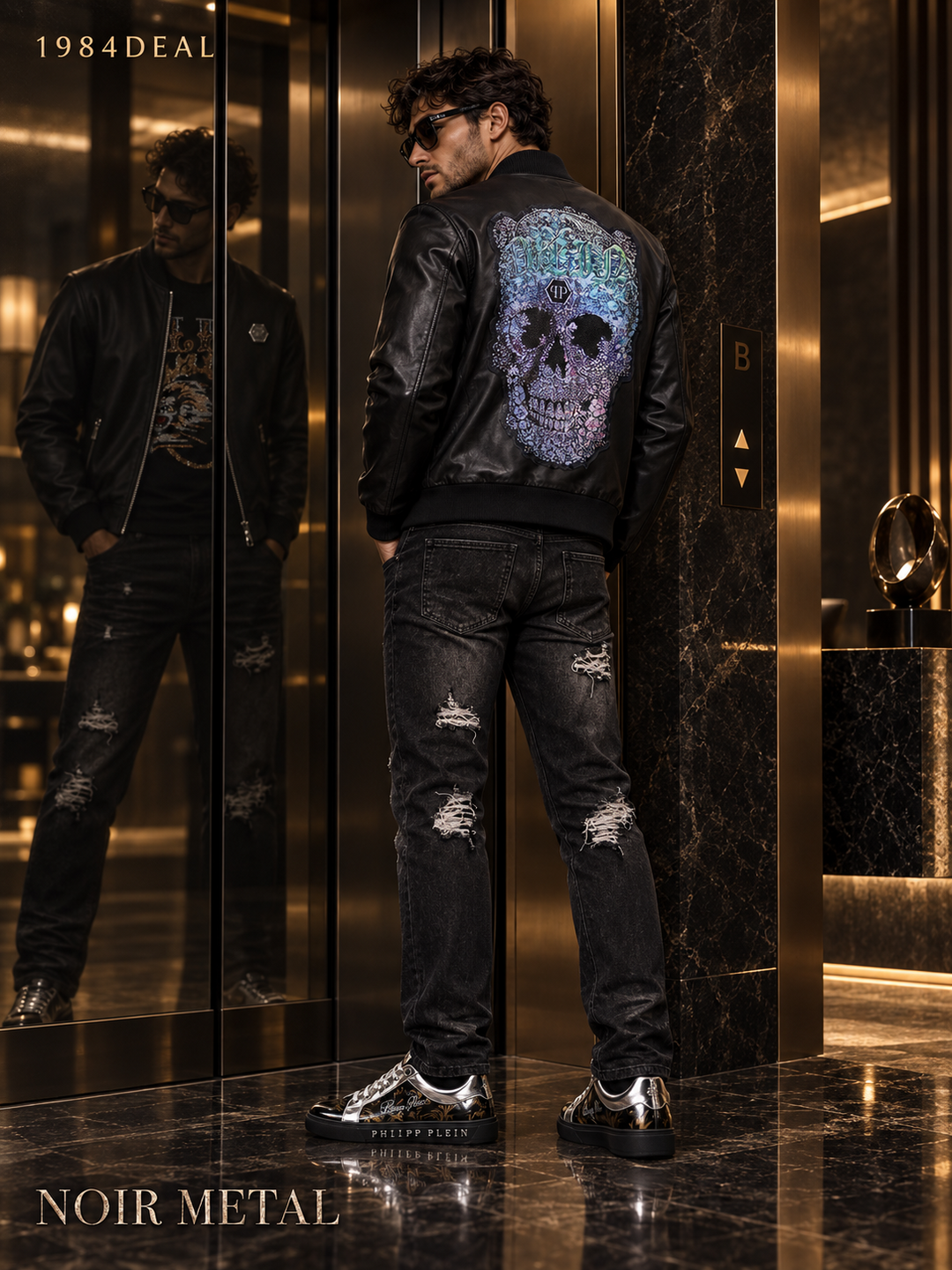 Adult man in a black graphic leather jacket, distressed black jeans and metallic black sneakers in a bronze hotel lobby
