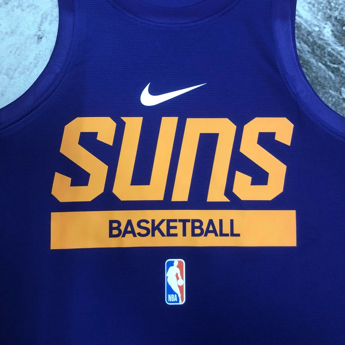 Suns Chest Logo Detail in Purple — Flatlay