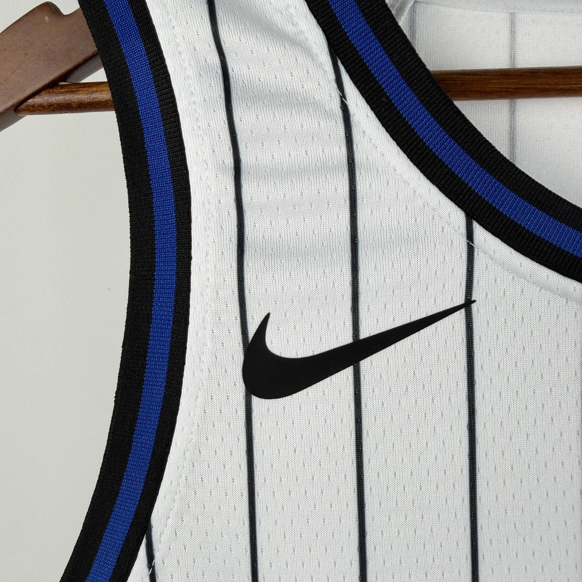 Orlando Magic 2025-26 home basketball jersey close-up of team logo embroidery in white for basketball fans