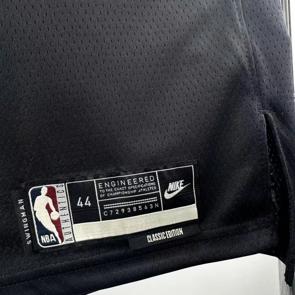 Philadelphia 76ers 2025-26 throwback edition basketball jersey close-up of jock tag and hem details in black for basketball fans