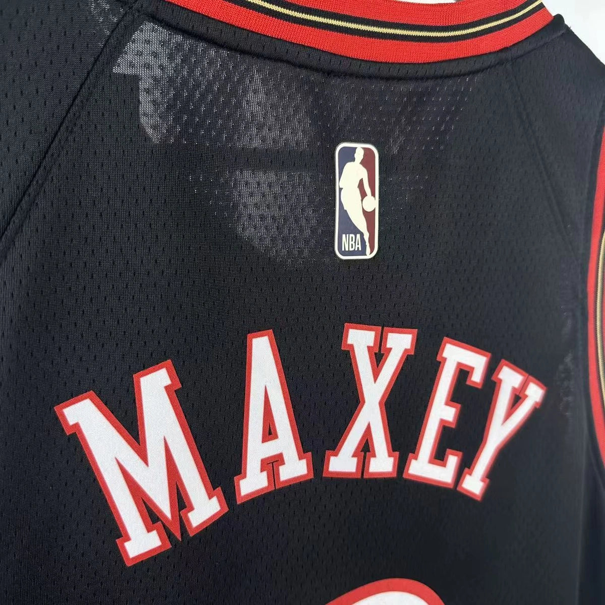 Philadelphia 76ers 2025-26 throwback edition basketball jersey front flat lay view in black for basketball fans