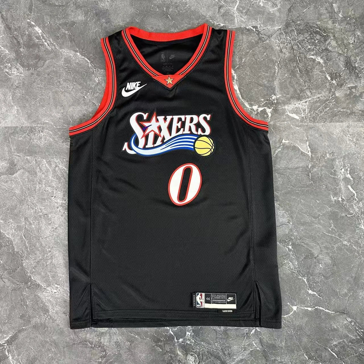 Philadelphia 76ers 2025-26 throwback edition basketball jersey angled back view in black for basketball fans