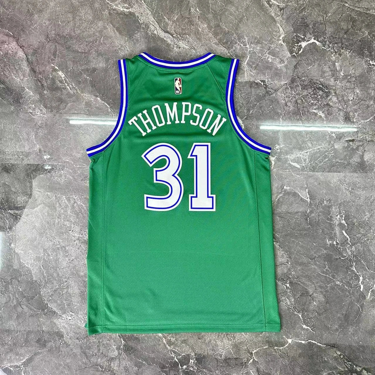 Dallas Mavericks 2025-26 throwback edition basketball jersey close-up of team logo embroidery in green for basketball fans