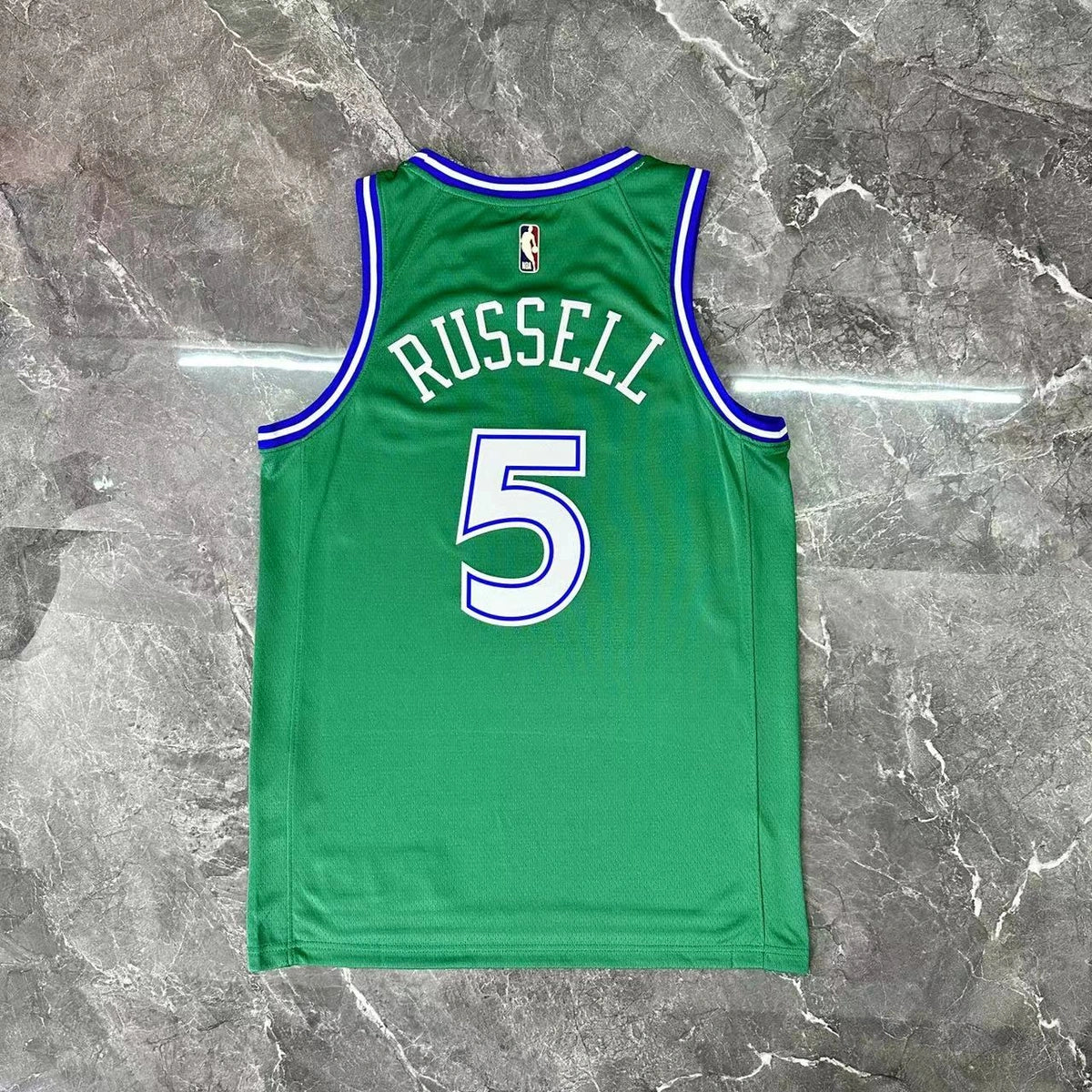 Dallas Mavericks 2025-26 throwback edition basketball jersey angled back view in green for basketball fans