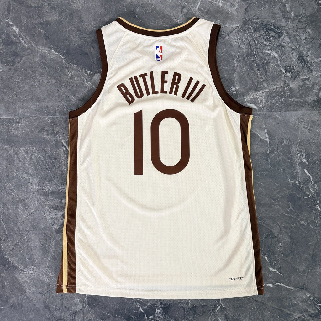 Golden State Warriors 2025-26 city edition basketball jersey close-up of jock tag and hem details in team colors for basketball fans