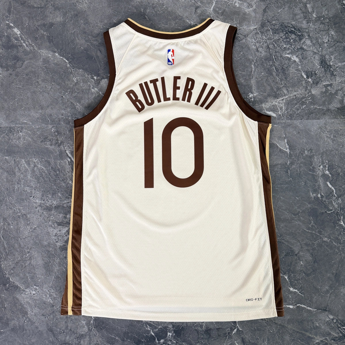 Golden State Warriors 2025-26 city edition basketball jersey close-up of jock tag and hem details in team colors for basketball fans