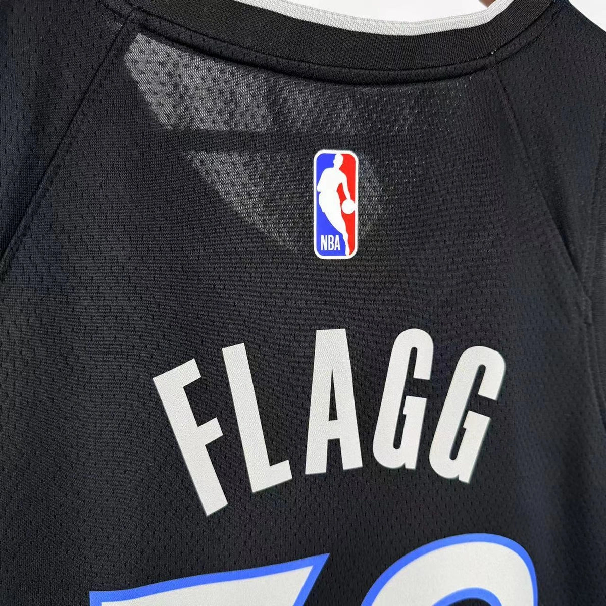 Dallas Mavericks 2025-26 throwback edition basketball jersey close-up of jersey number and player name in green for basketball fans